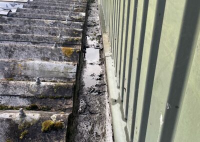 Tidy up old debris on commercial roof Plumbing and Drainage Company Cheshunt Waltham Cross